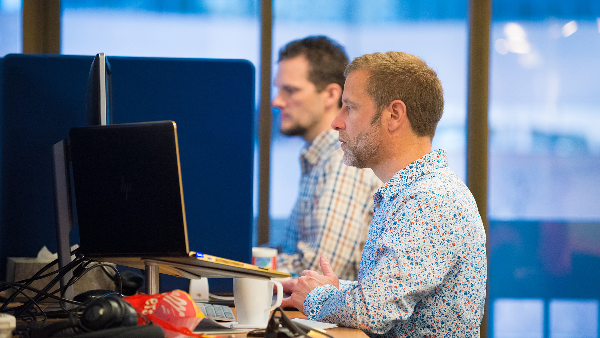 Two engineers working at a desk