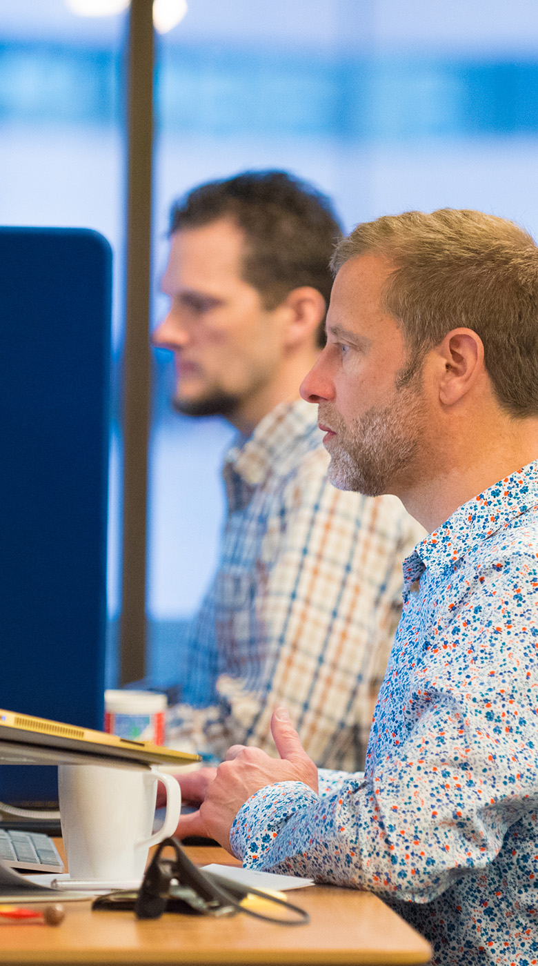 two people working at computers